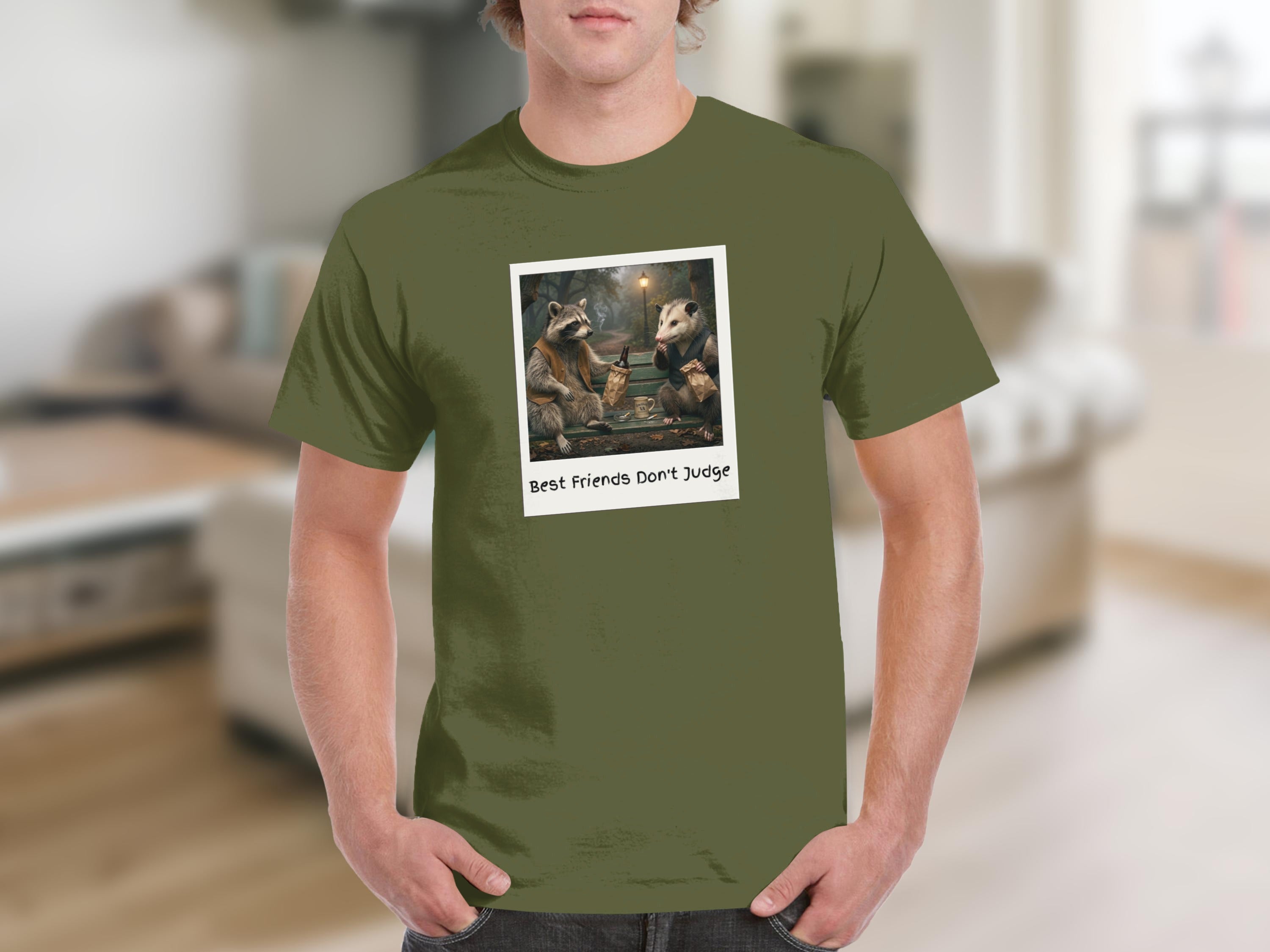 T-shirt with a graphic of a raccoon and possum on a bench, text "Best Friends Don't Judge."