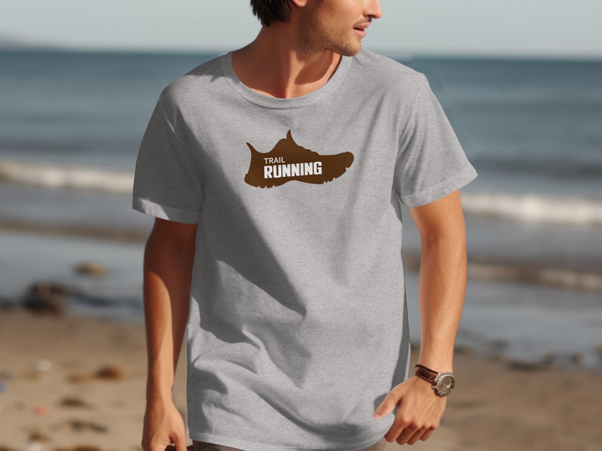 Grey t-shirt with brown trail running shoe graphic and text.