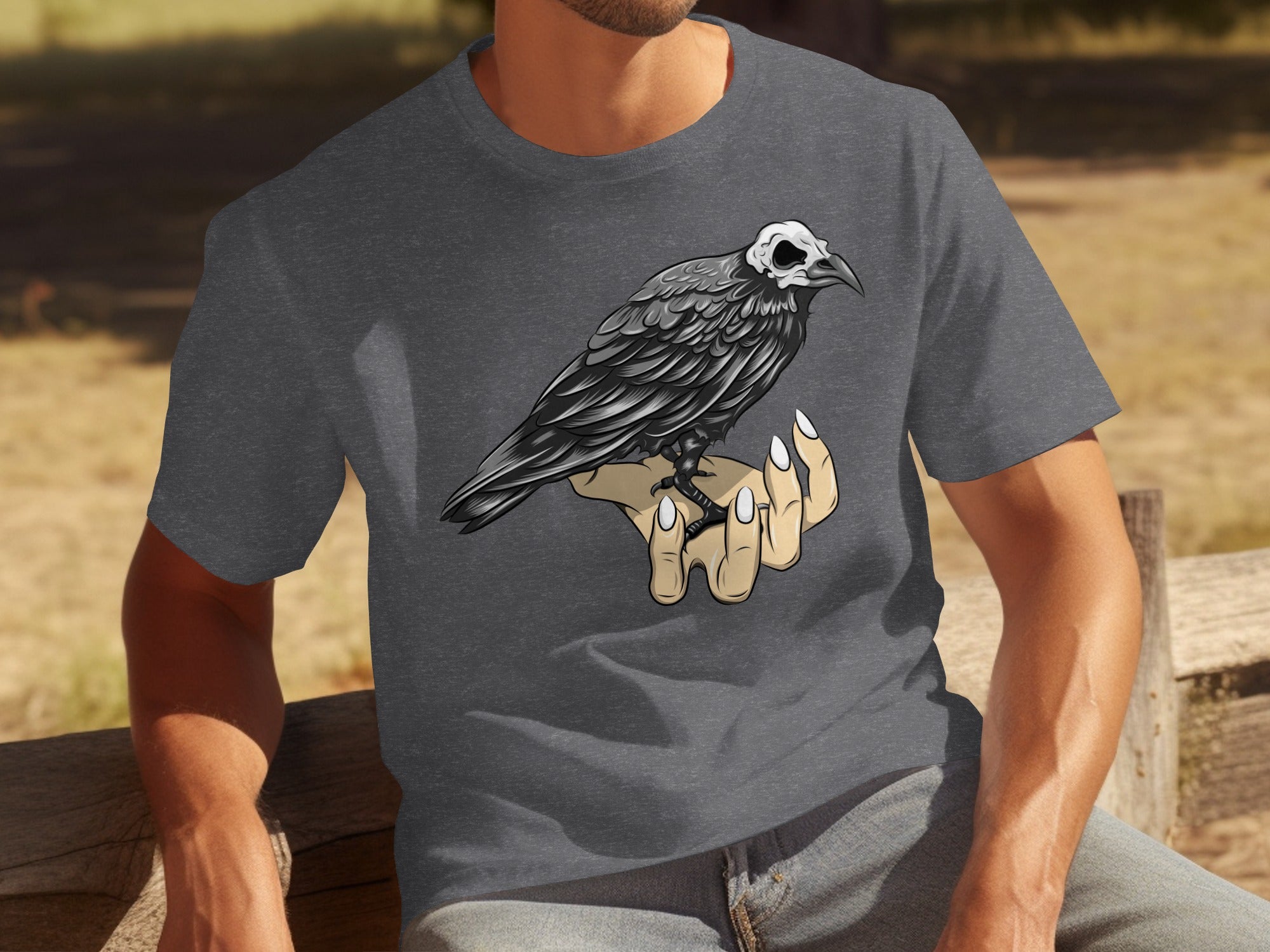 Dark grey t-shirt with a stylized crow perched on a skeletal hand.