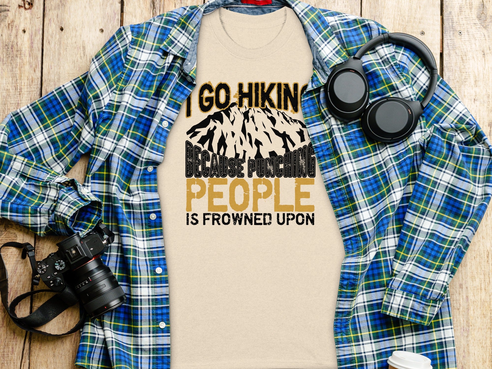 T-shirt with "I Go Hiking Because Punching People Is Frowned Upon" text.