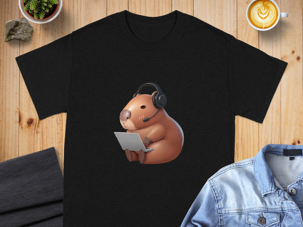 Black t-shirt with a capybara wearing headphones and using a laptop.