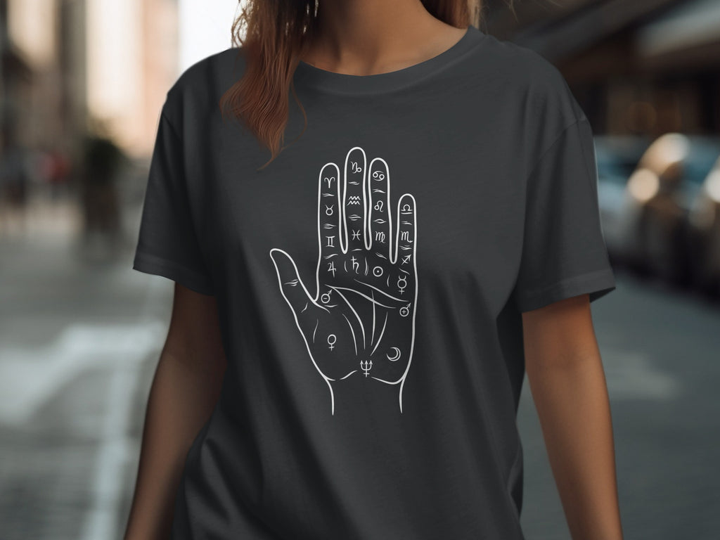 Dark gray t-shirt with white palmistry hand and astrological symbols design.