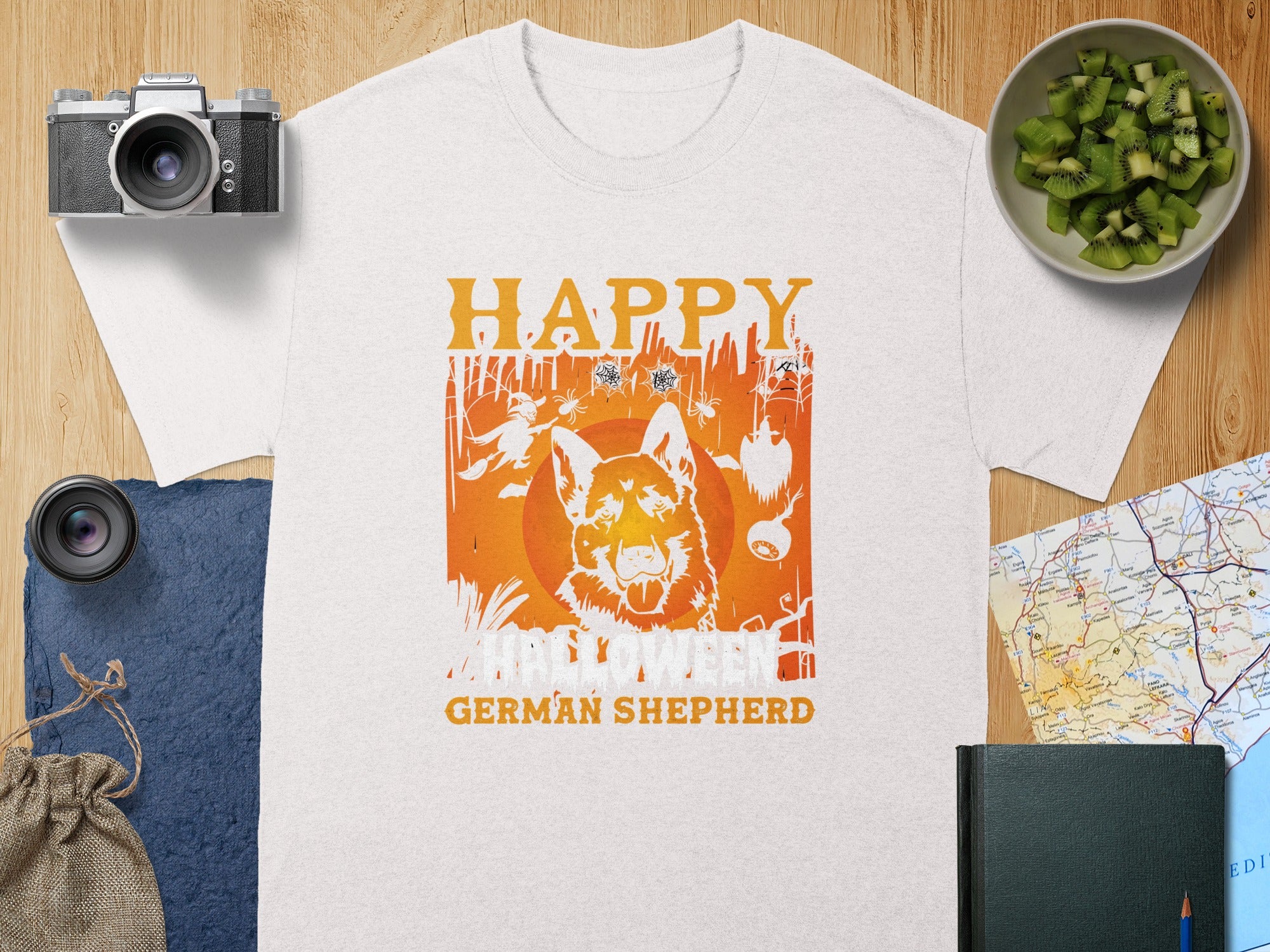 White t-shirt with "Happy Halloween German Shepherd" graphic and spooky forest scene.