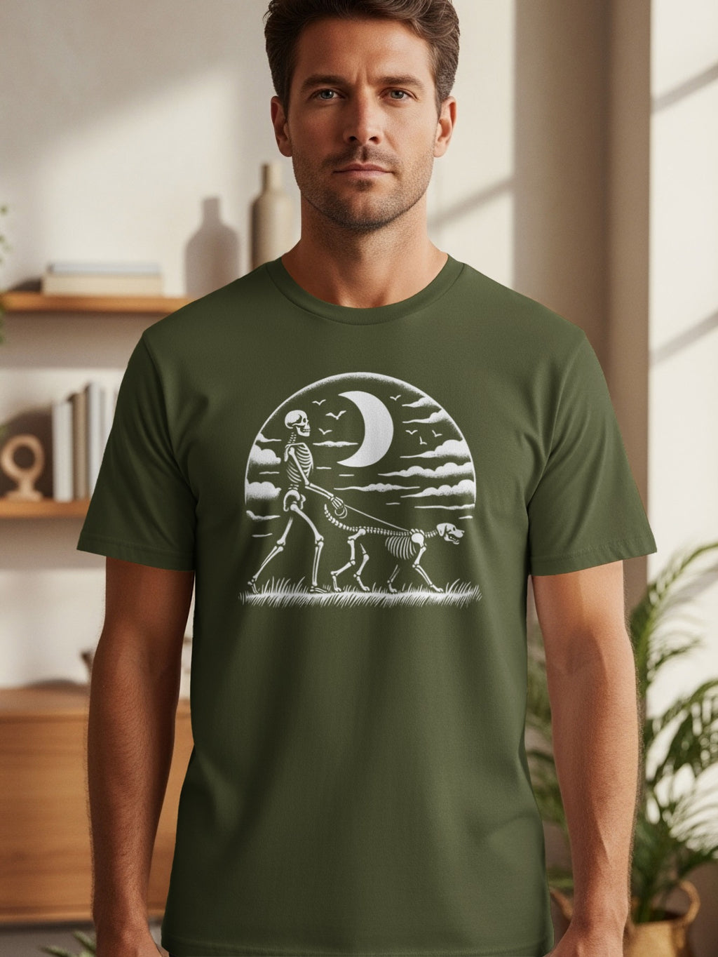Skeleton walking dog under moon and clouds design on olive green t-shirt.