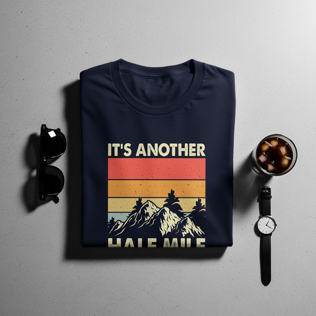 Navy t-shirt with "IT'S ANOTHER HALF MILE" and mountain graphic.
