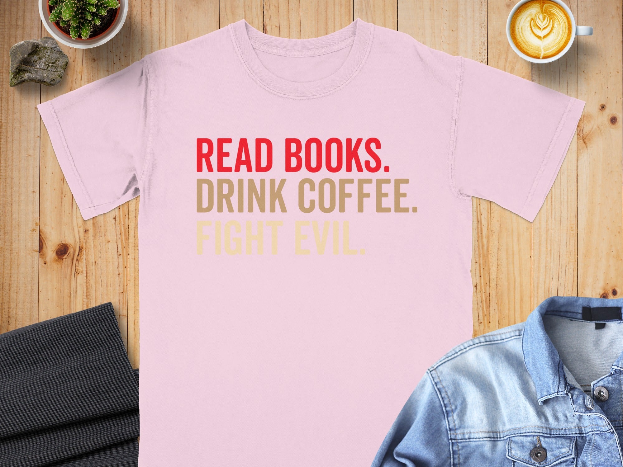 Pink t-shirt with red text "READ BOOKS. DRINK COFFEE. FIGHT EVIL."