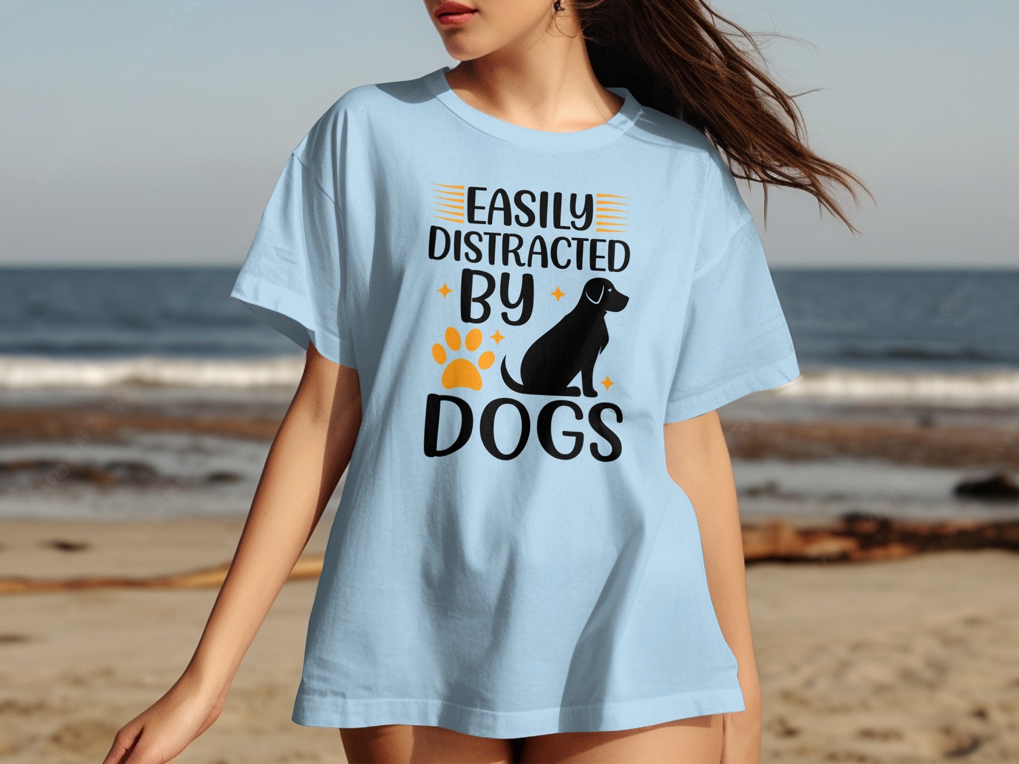 Light blue t-shirt with text "EASILY DISTRACTED BY DOGS" and dog silhouette.