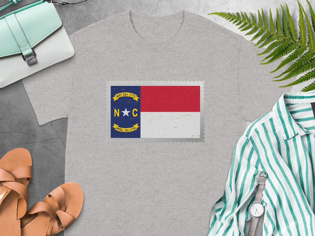 Grey t-shirt with a North Carolina flag postage stamp design.
