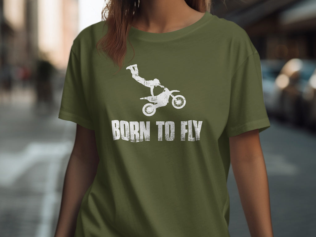 Green t-shirt with white distressed graphic of motocross rider mid-air and text "BORN TO FLY".