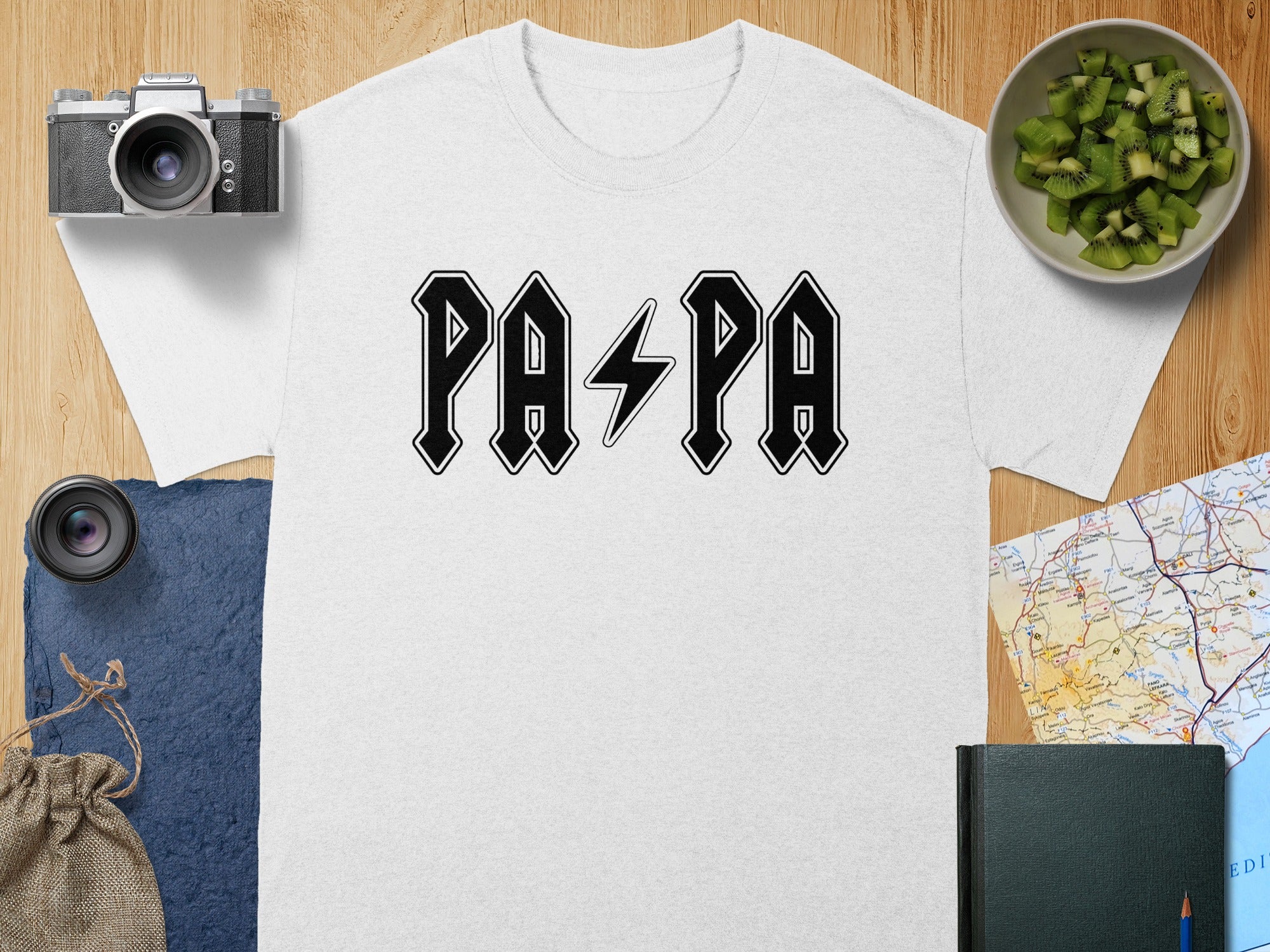 White t-shirt with black "PAPA" text in a distressed rock band style font.