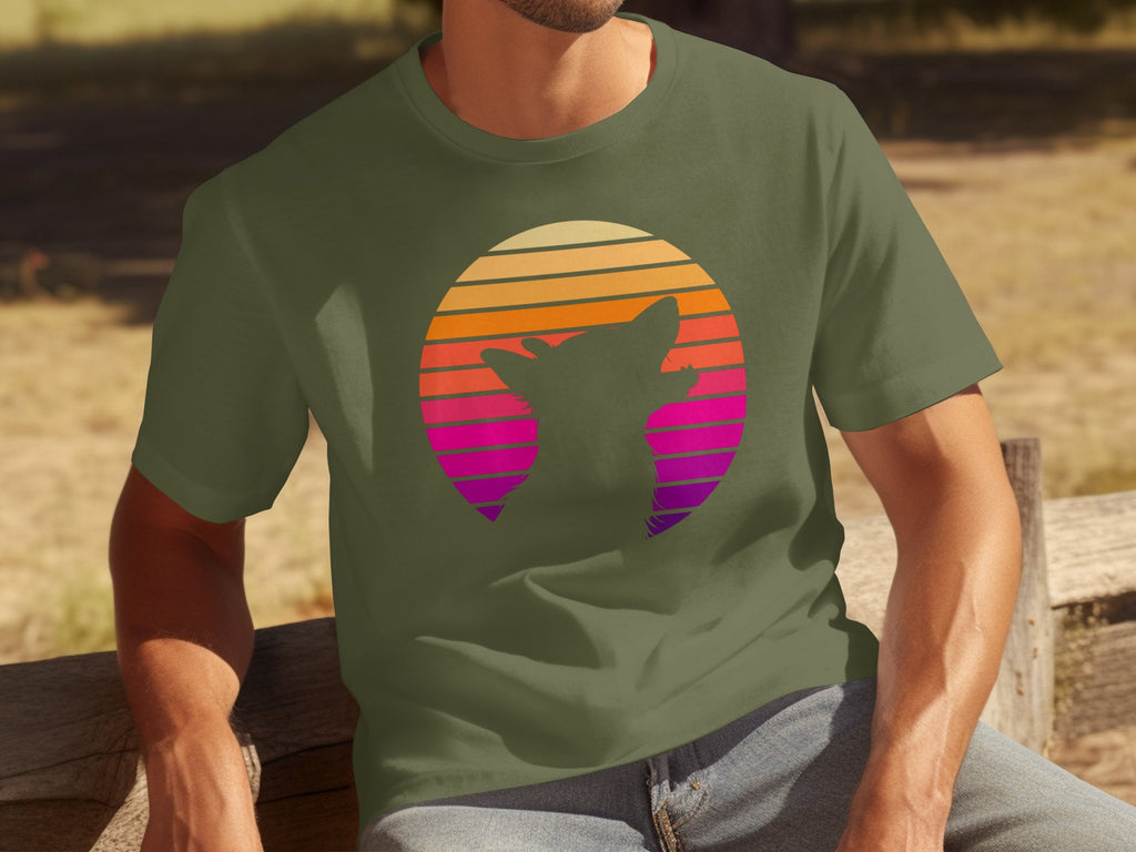 Green t-shirt with a silhouette of a dog against a retro striped sunset circle.