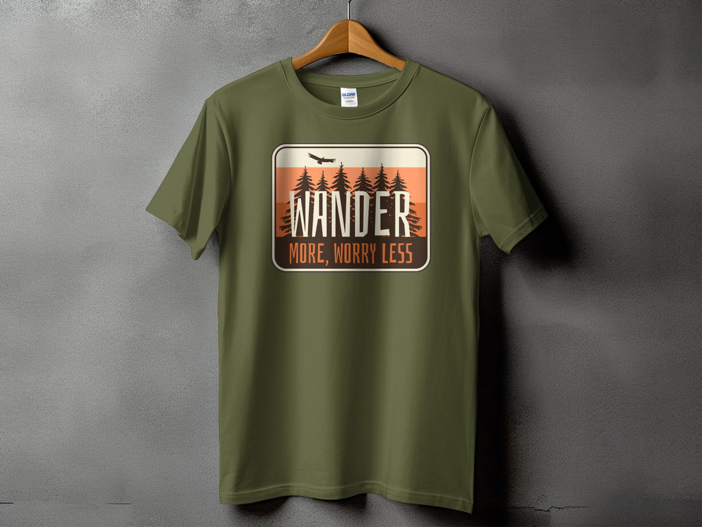 Green t-shirt with "Wander More, Worry Less" graphic and pine trees.