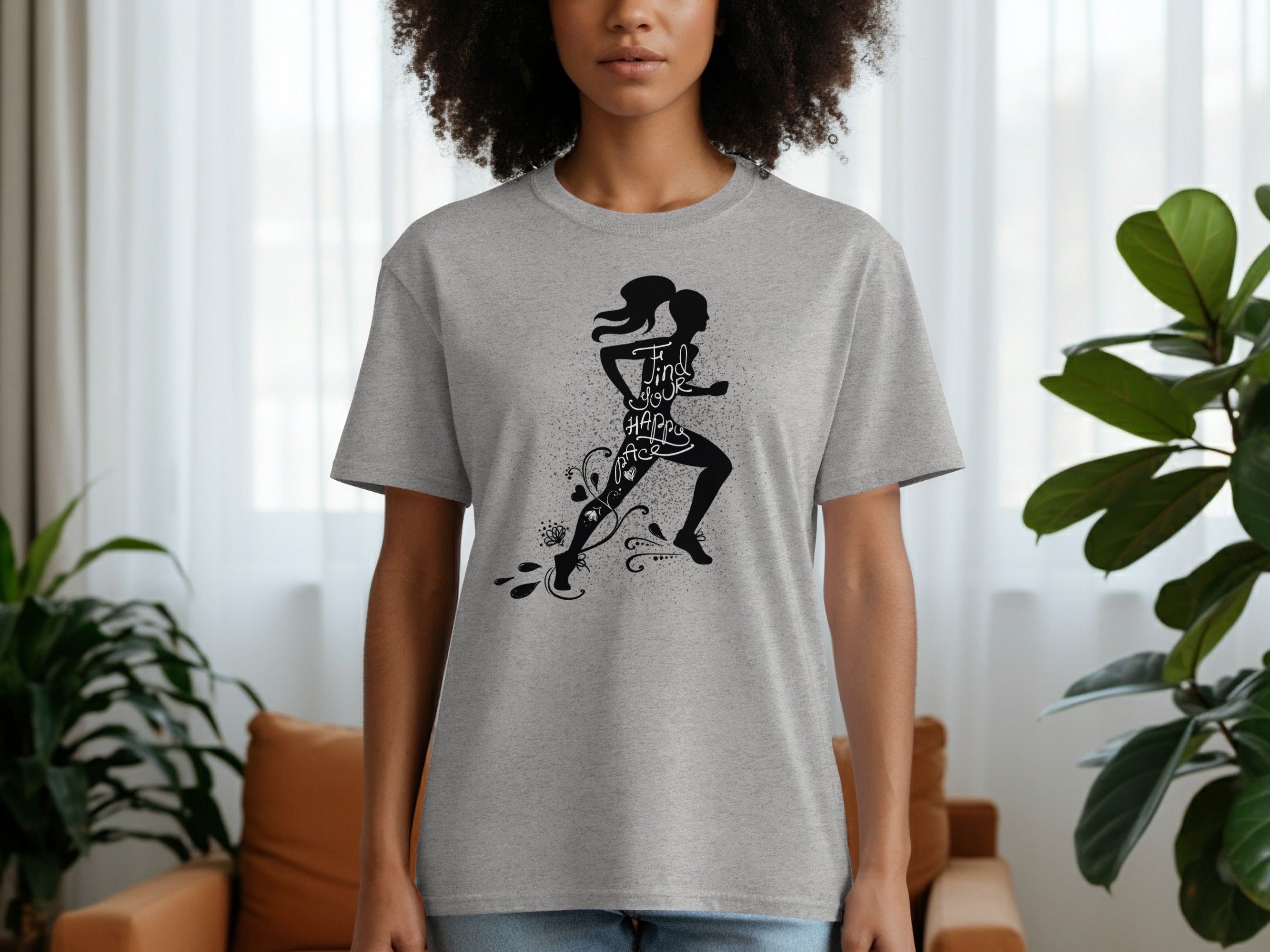 Grey t-shirt with black silhouette of a runner and the text "Find Your Happy Pace".
