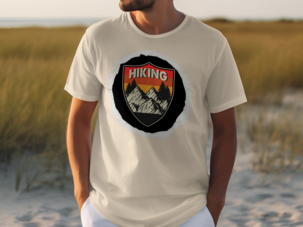 T-shirt with a crest graphic featuring mountains, trees, and the word "Hiking".