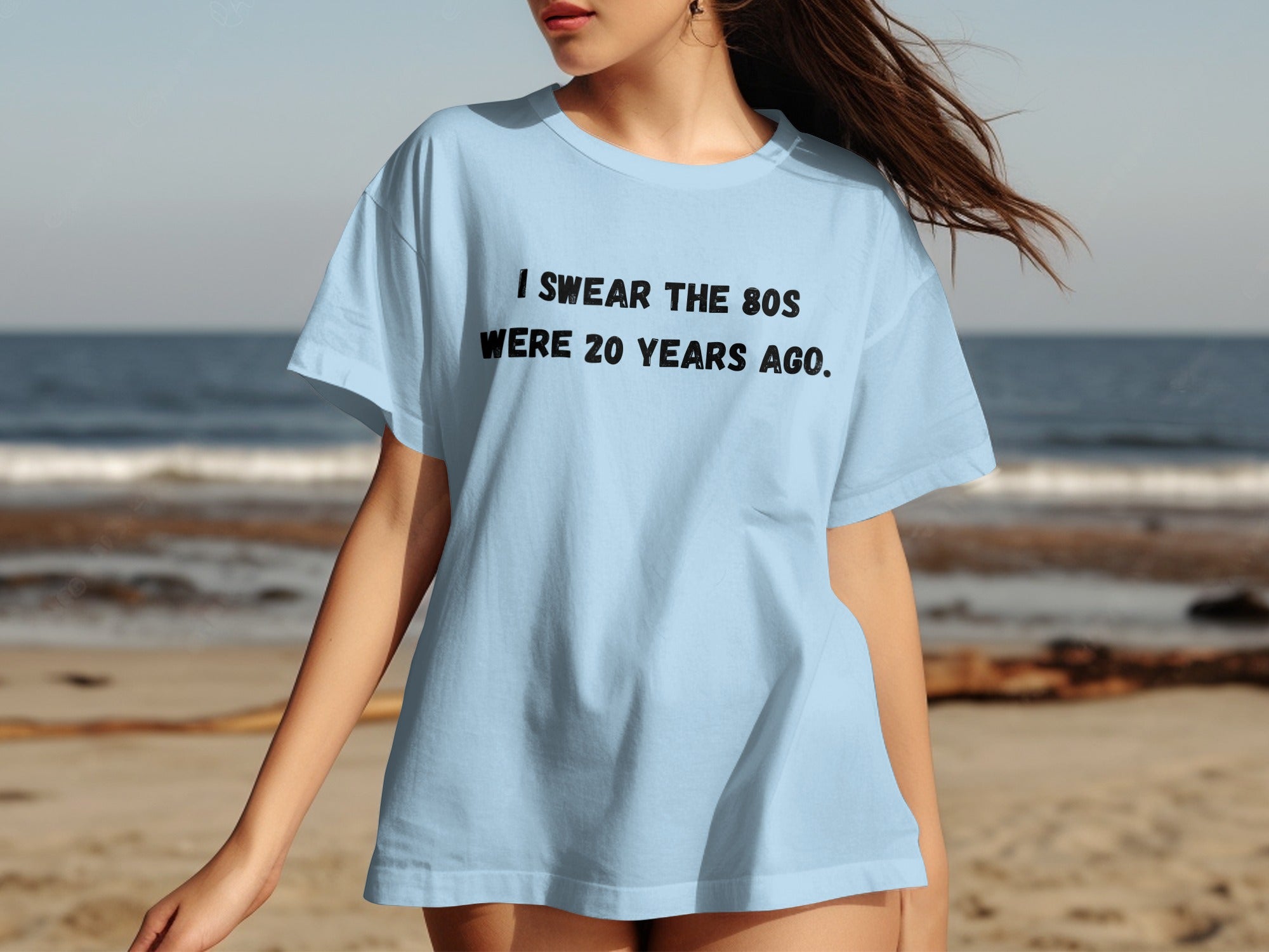 Light blue t-shirt with black text that reads "I SWEAR THE 80S WERE 20 YEARS AGO."