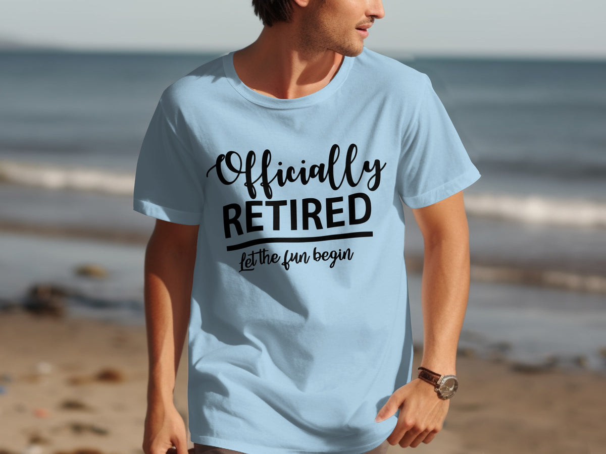 Light blue t-shirt with black text reading "Officially RETIRED let the fun begin."