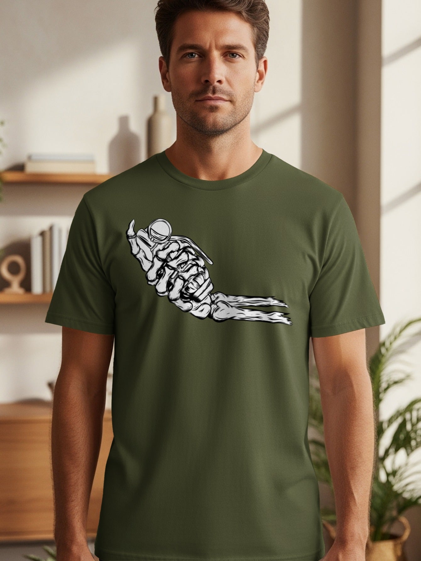 Skeleton hand holding a grenade graphic on a green t-shirt.