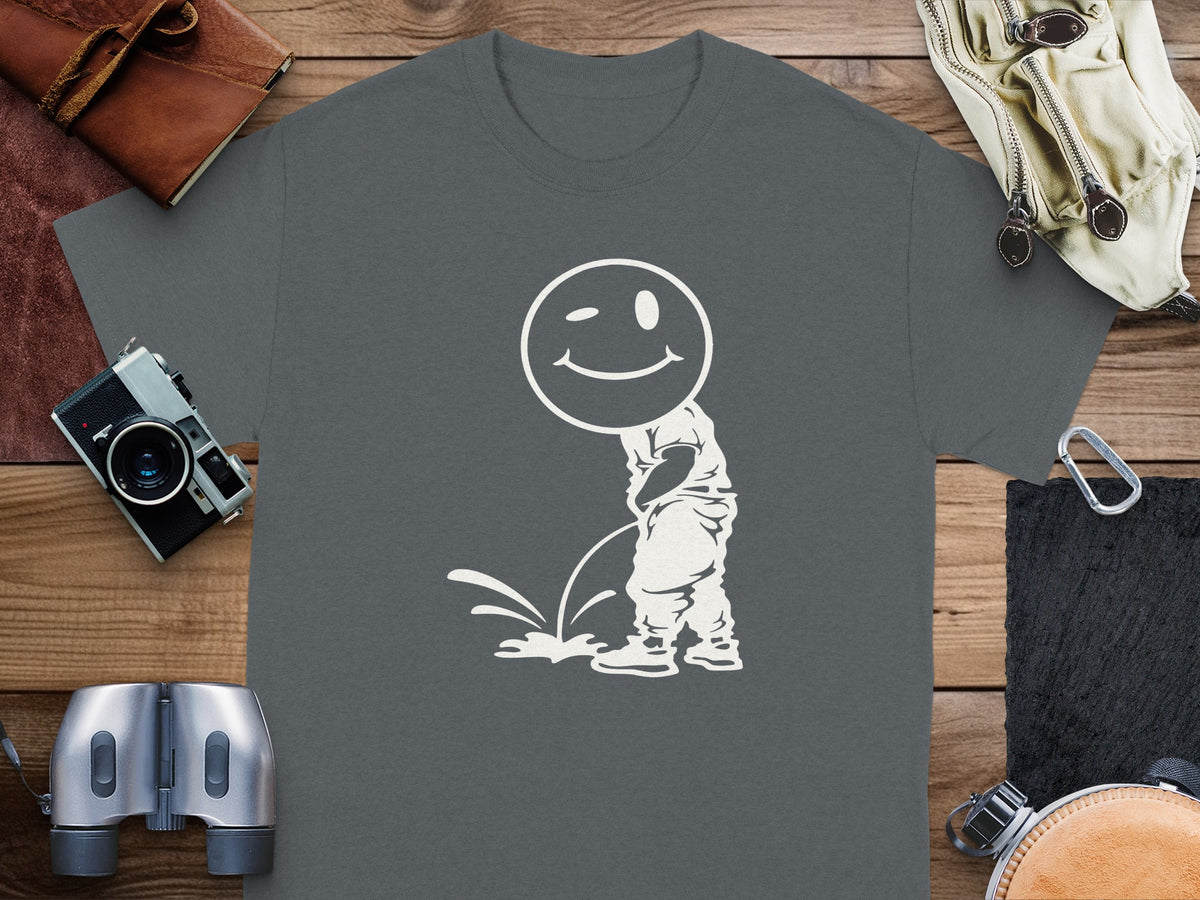 Dark grey t-shirt with white graphic of a winking smiley face urinating.