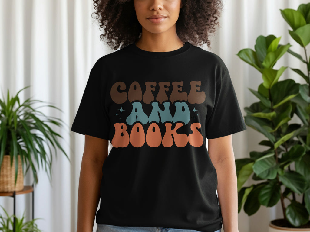 Black t-shirt with "COFFEE AND BOOKS" text in retro style lettering.