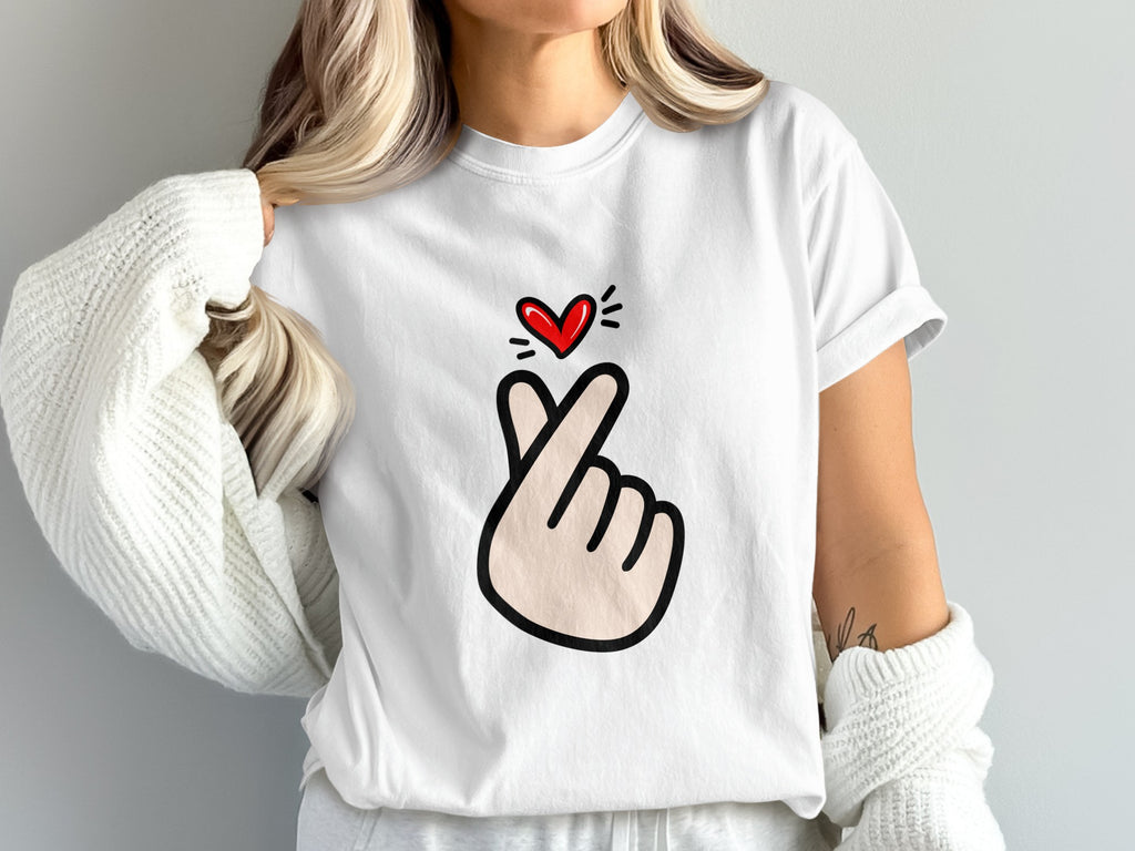 White t-shirt with a gesture forming a heart and a red heart above.