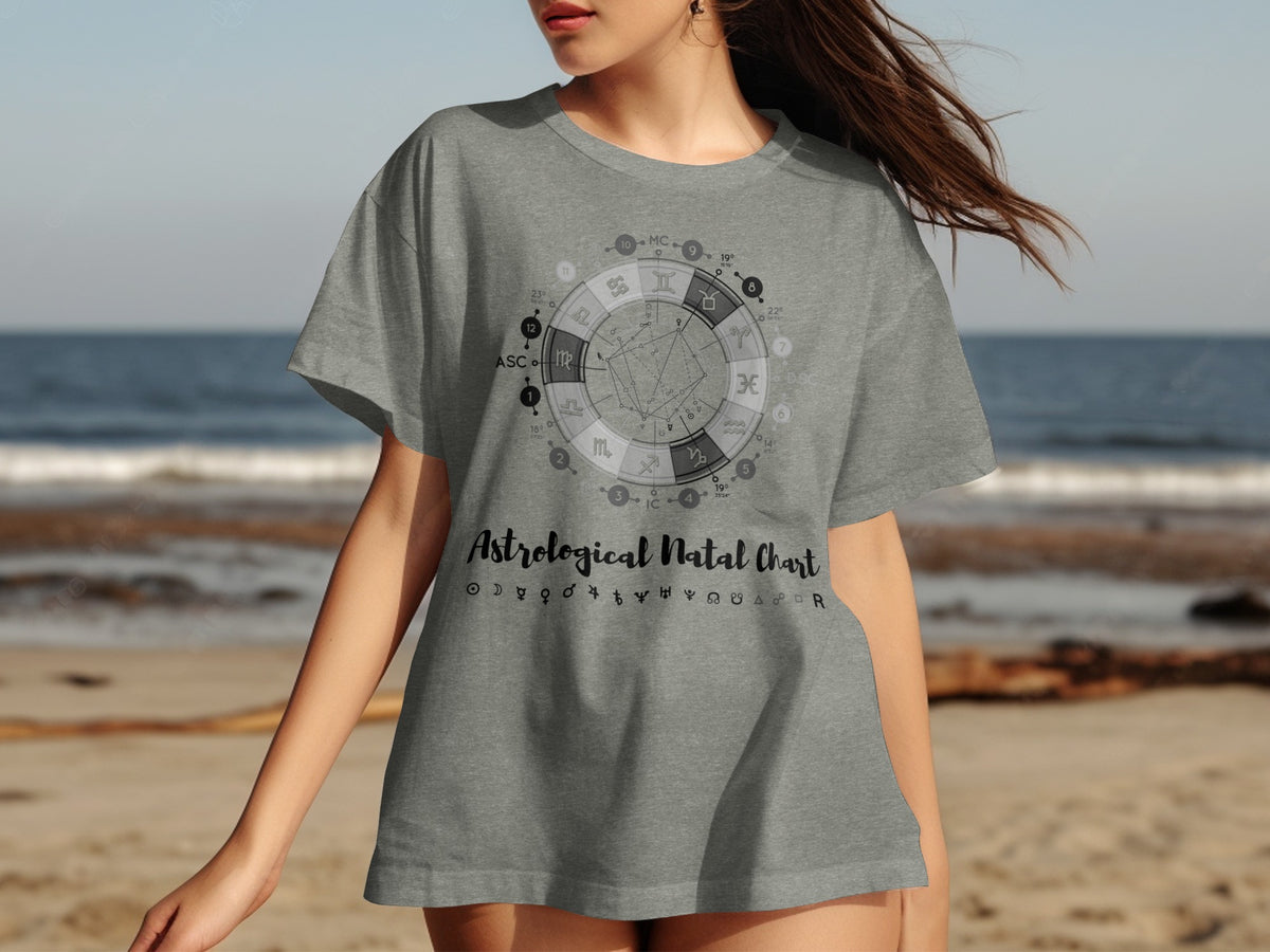 Gray t-shirt with astrological natal chart and symbols, beach background.