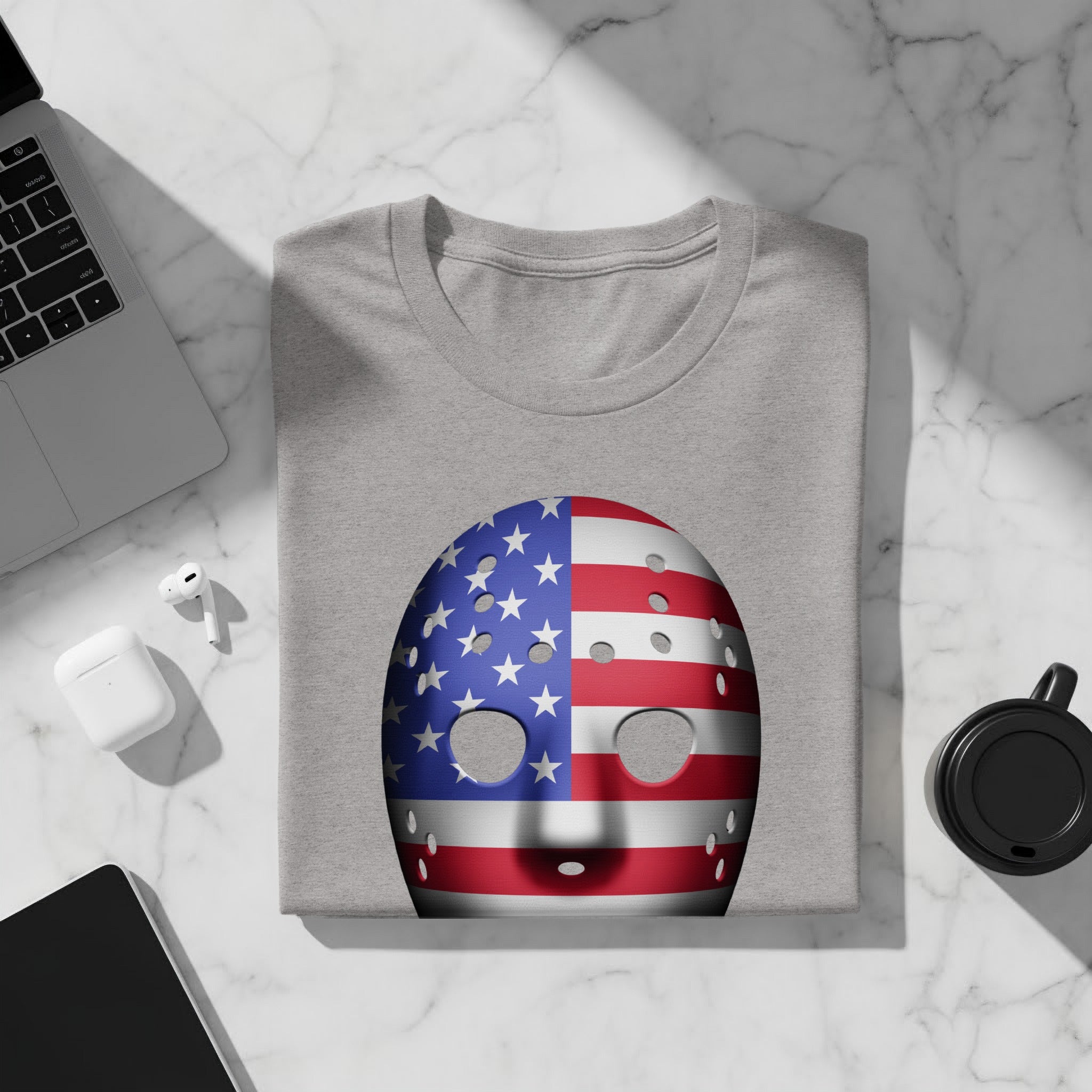 Grey t-shirt with an American flag hockey mask graphic.