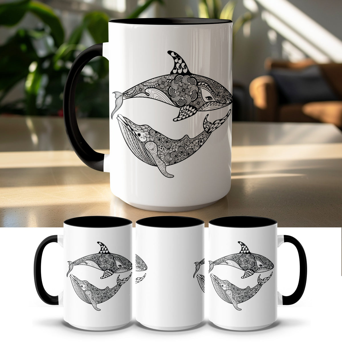 White mug with black interior and handle, featuring black mandala designs of an orca and a whale.