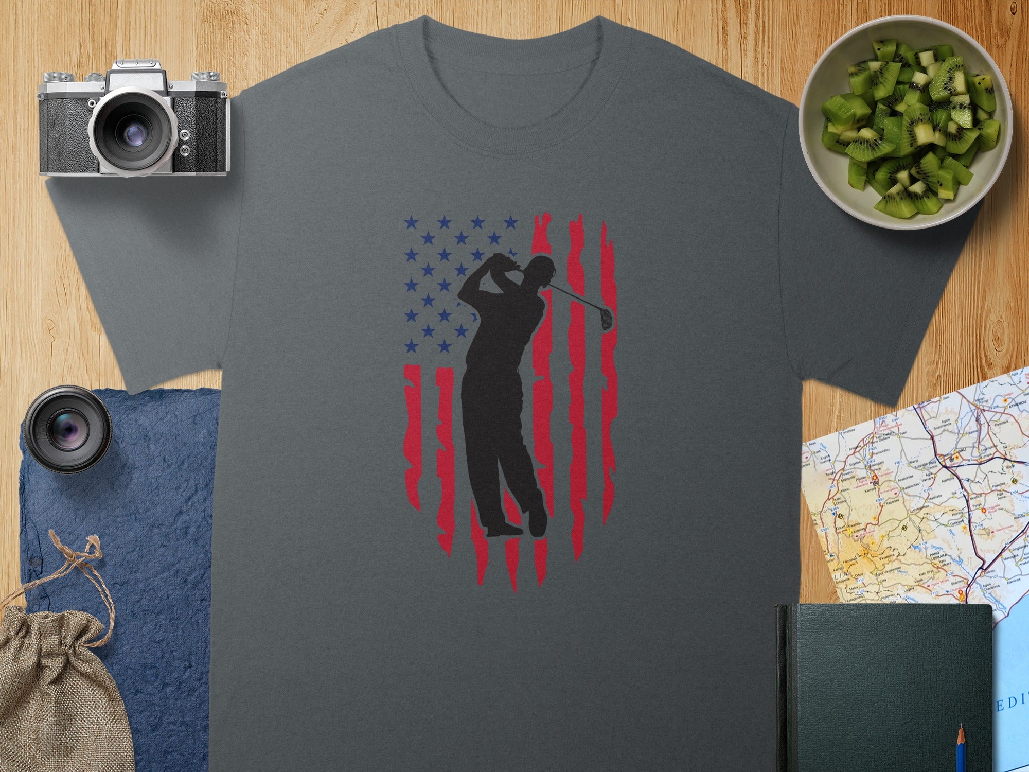 T-shirt with golfer silhouette against distressed American flag design.