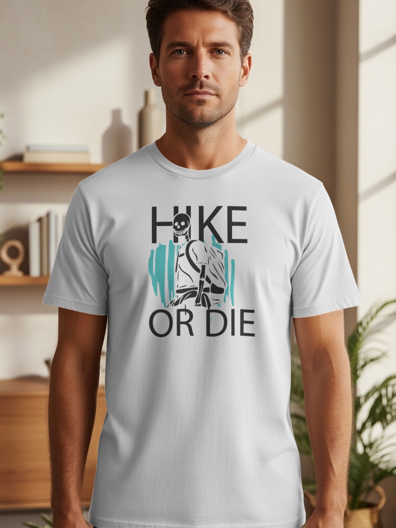 White t-shirt with "HIKE OR DIE" text and skeleton hiker graphic.