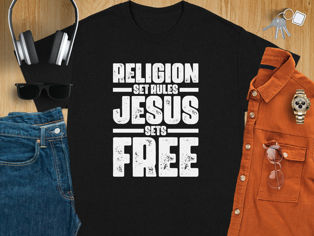 Black t-shirt with "RELIGION SET RULES JESUS SETS FREE" text.