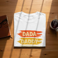 White t-shirt with "DADA" and "DADDY" text in distressed paint strokes.