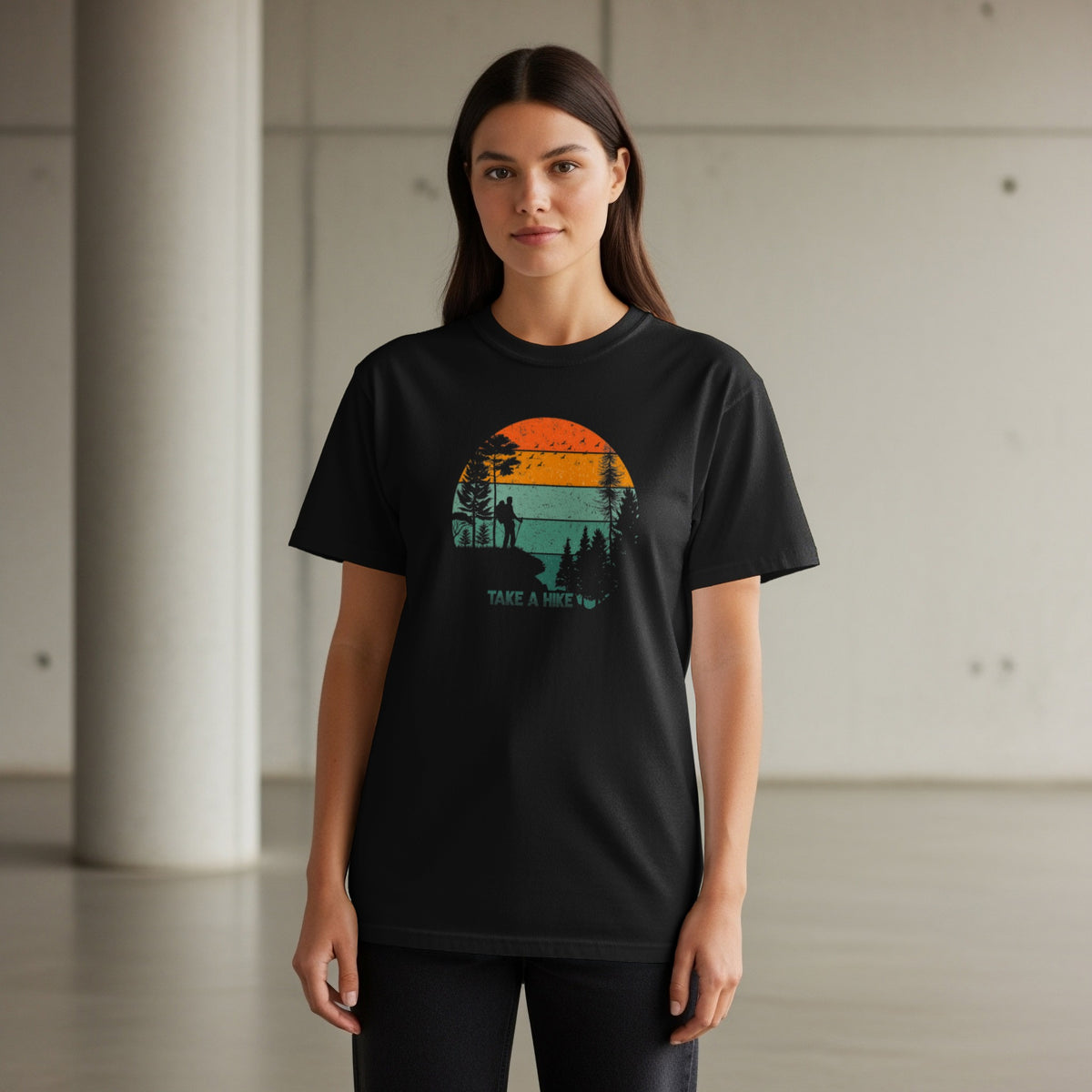 Black t-shirt with retro "Take a Hike" sunset graphic featuring hikers and trees.