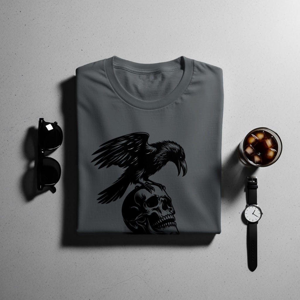 Dark grey t-shirt with a black graphic of a raven perched on a skull.