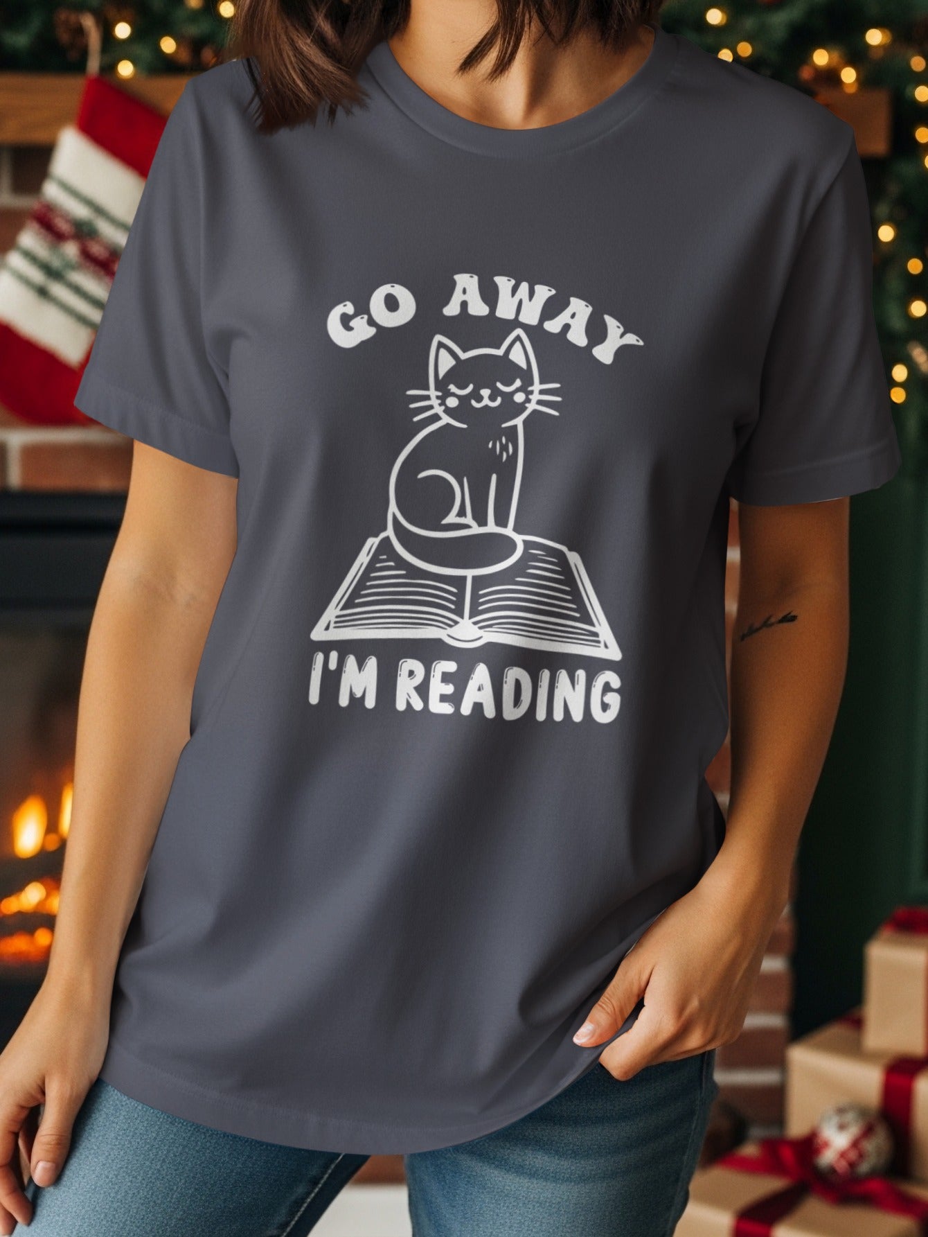 Dab gray t-shirt with white text and graphic of cat sitting on a book.
