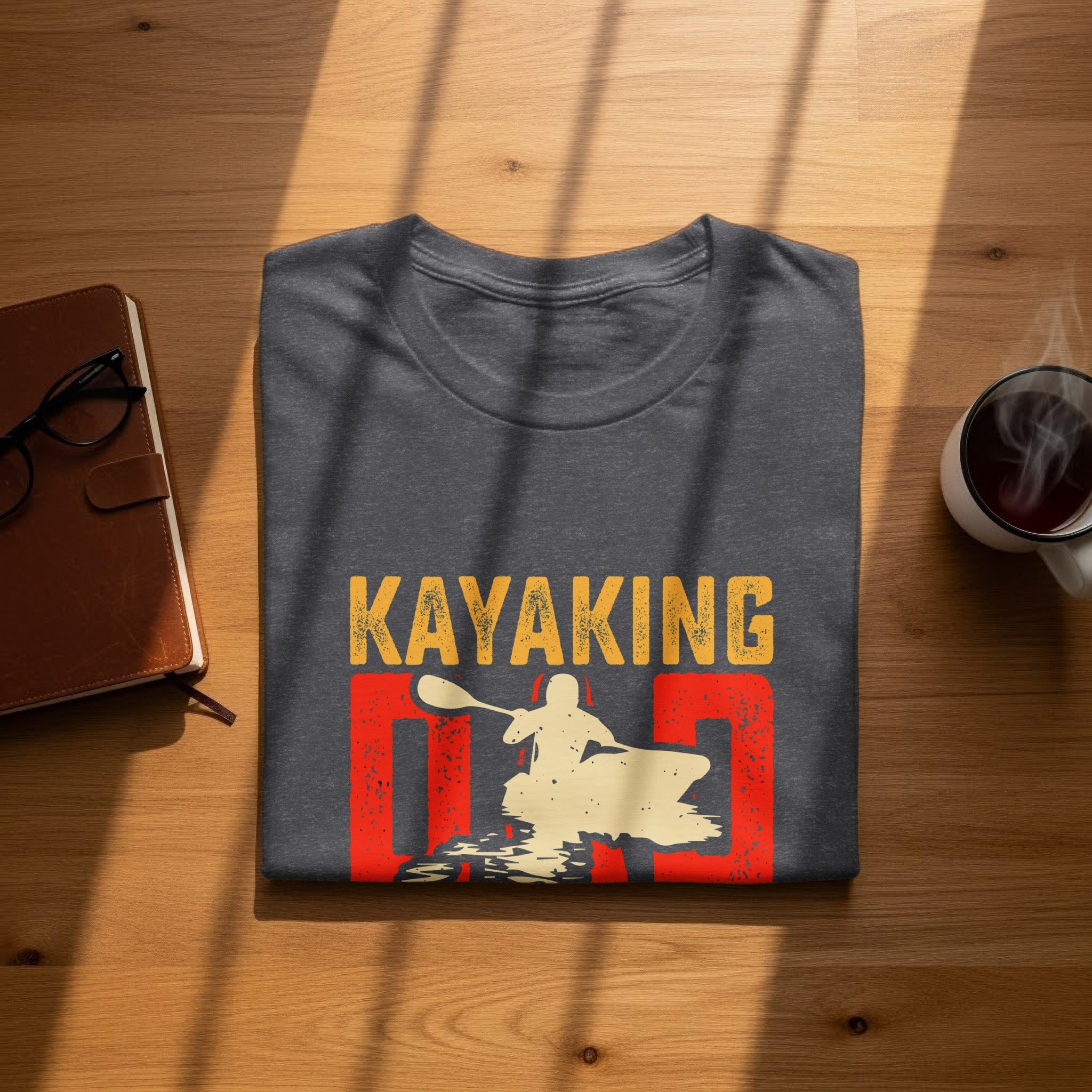Dark grey t-shirt with "Kayaking Dad" graphic featuring a kayaker silhouette.