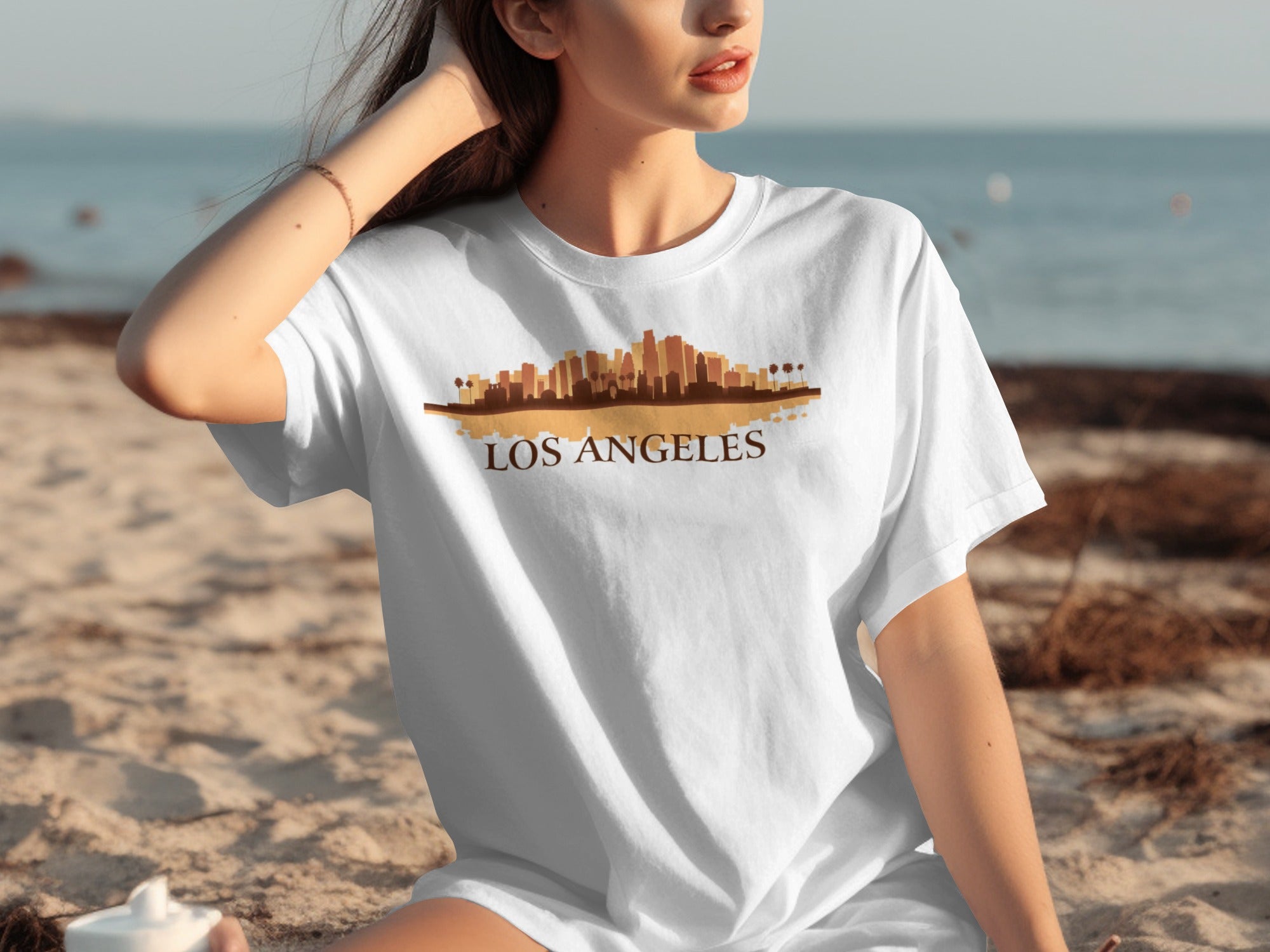 White t-shirt with brown Los Angeles skyline graphic and text.
