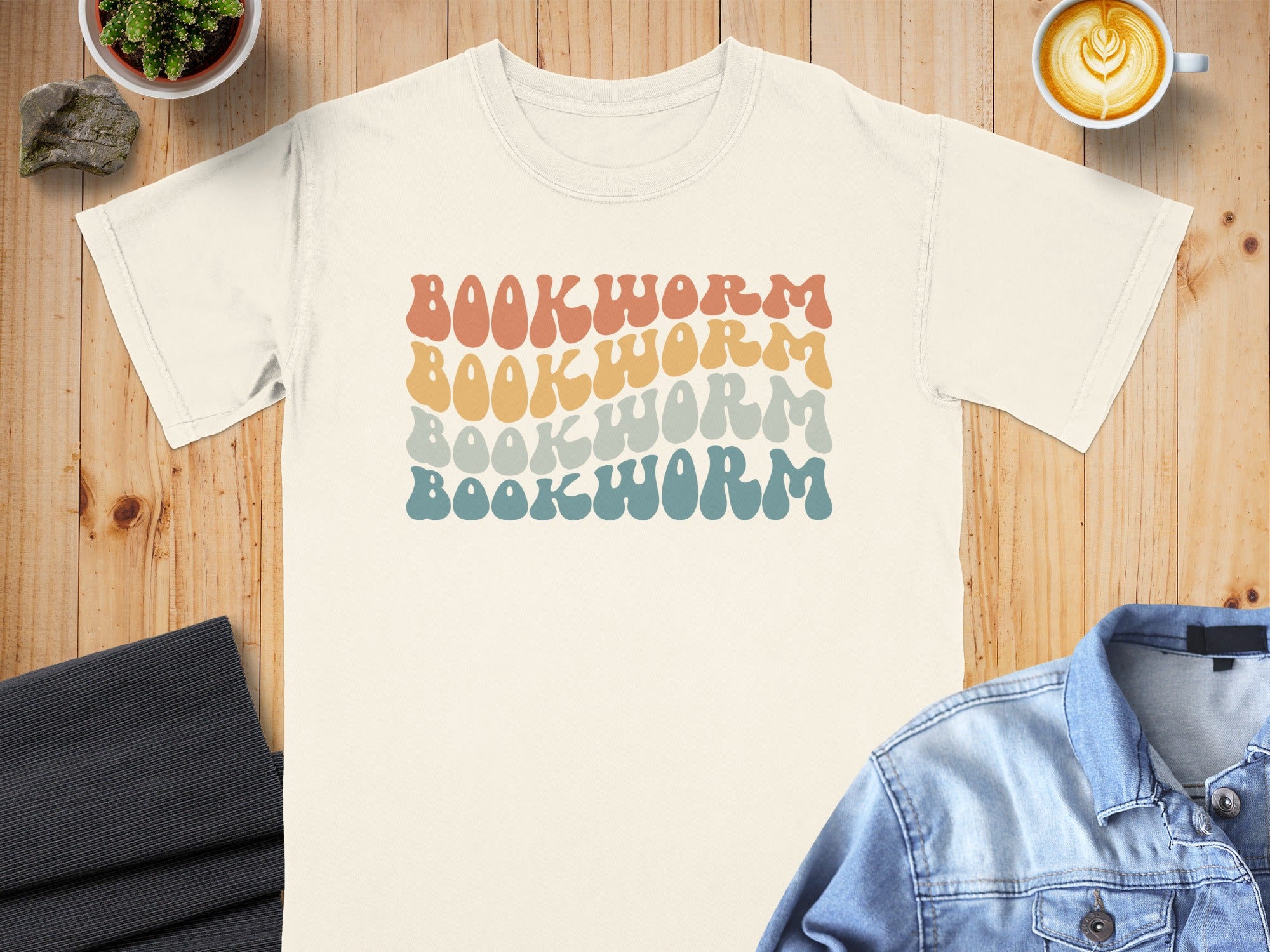 Cream t-shirt with "BOOKWORM" repeated in retro wavy text.