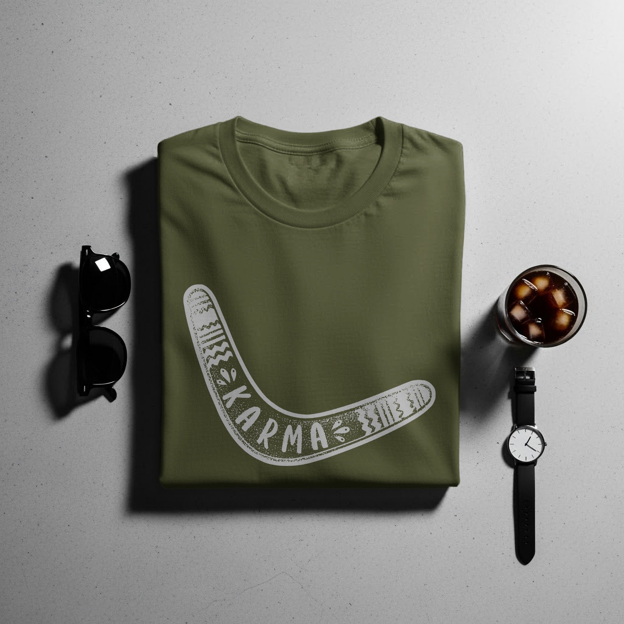 Olive green t-shirt with white boomerang graphic and "KARMA" text.