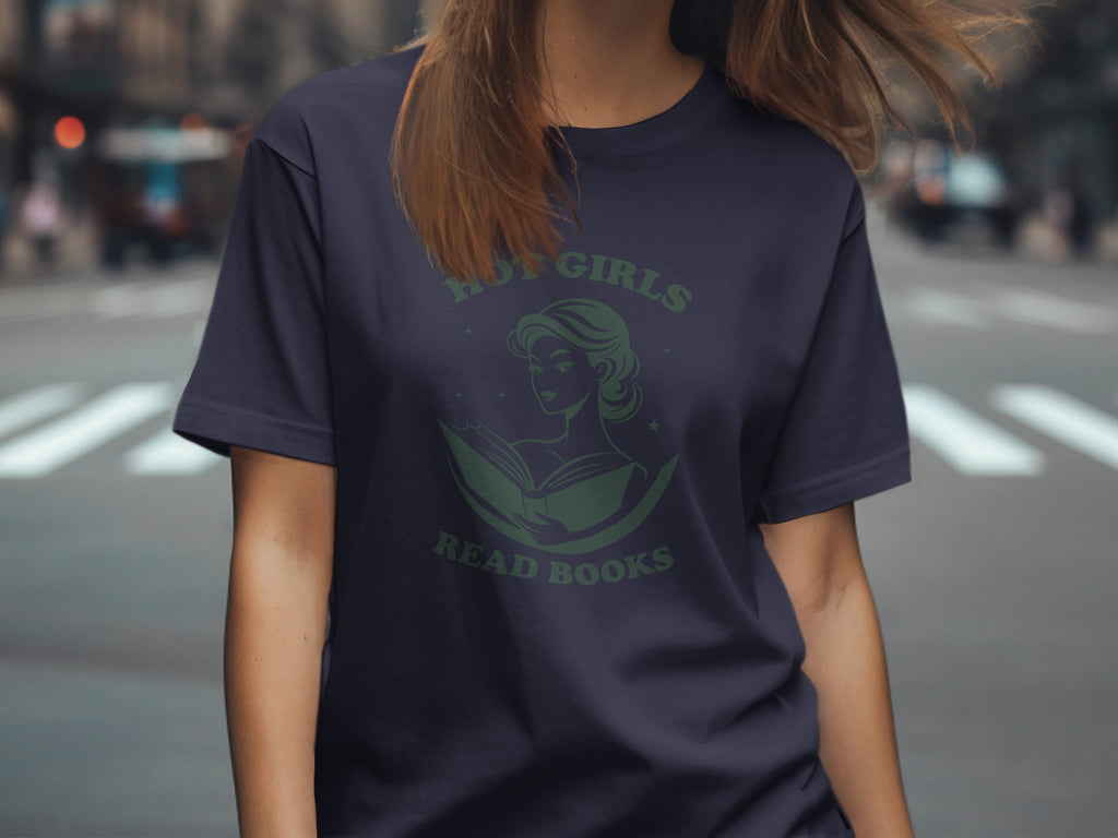 Dark blue t-shirt with green graphic of woman reading a book and text "Hot Girls Read Books".