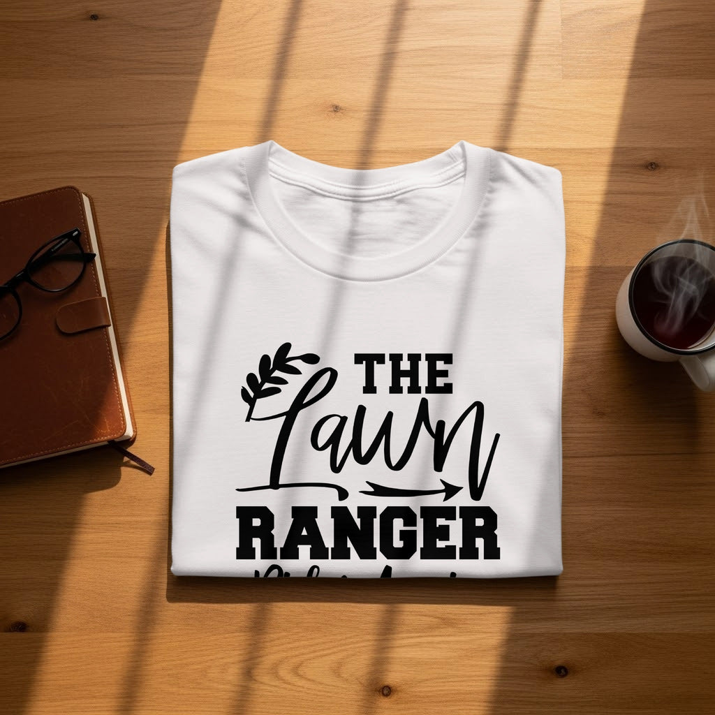White t-shirt with black text reading "The Lawn Ranger" and decorative flourishes.
