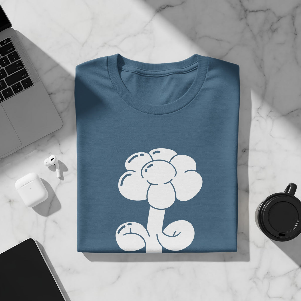 Blue t-shirt with a white cartoon flower graphic.