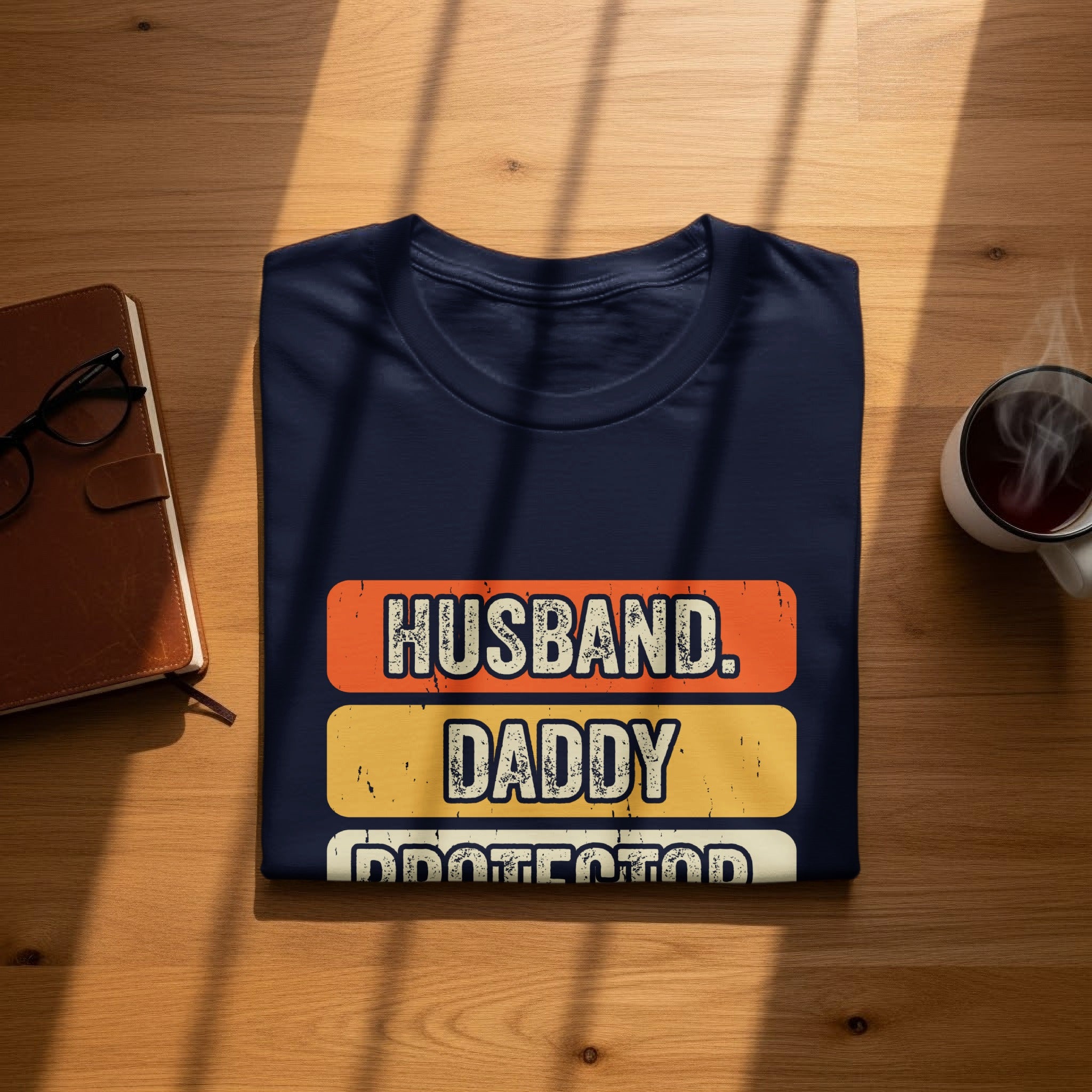 Navy t-shirt with "HUSBAND. DADDY PROTECTOR." text in distressed colorful blocks.