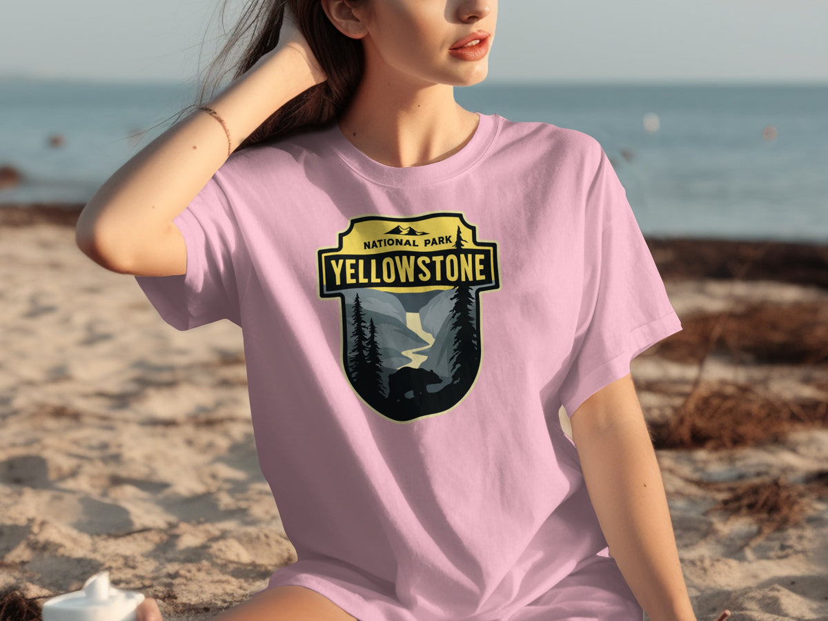 Pink t-shirt with Yellowstone National Park badge featuring a bear and trees.