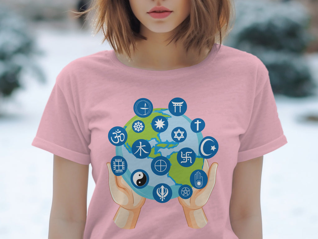 Pink t-shirt with a graphic of hands holding the Earth surrounded by religious symbols.