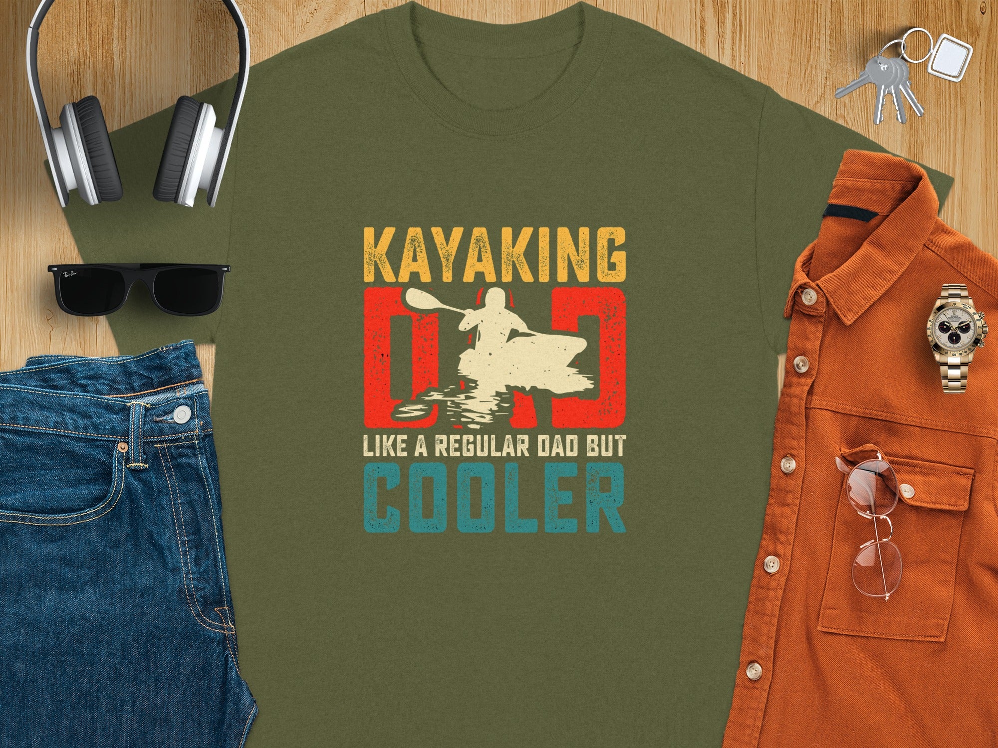 Green t-shirt with graphic: "Kayaking Dad" and "Like a Regular Dad But Cooler".