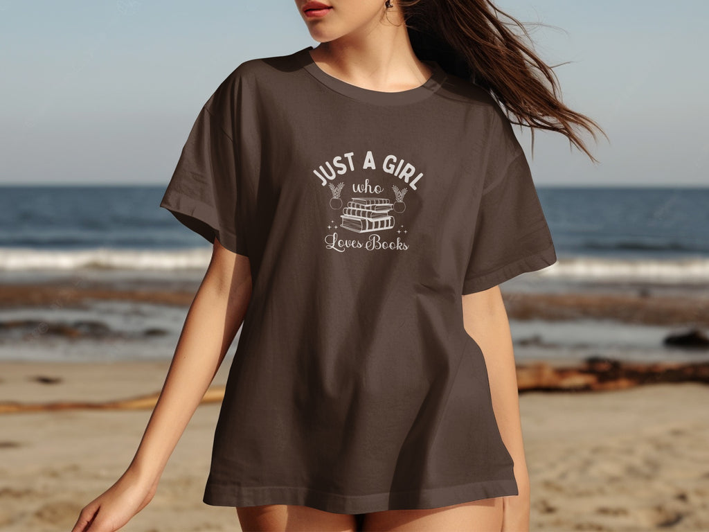 Brown t-shirt with "Just a girl who loves books" text and stacked books design.