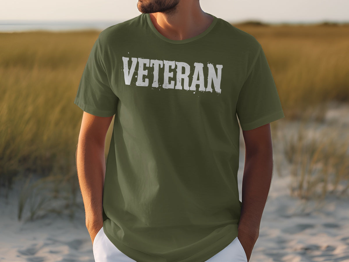 Olive green t-shirt with distressed white text that says "VETERAN".