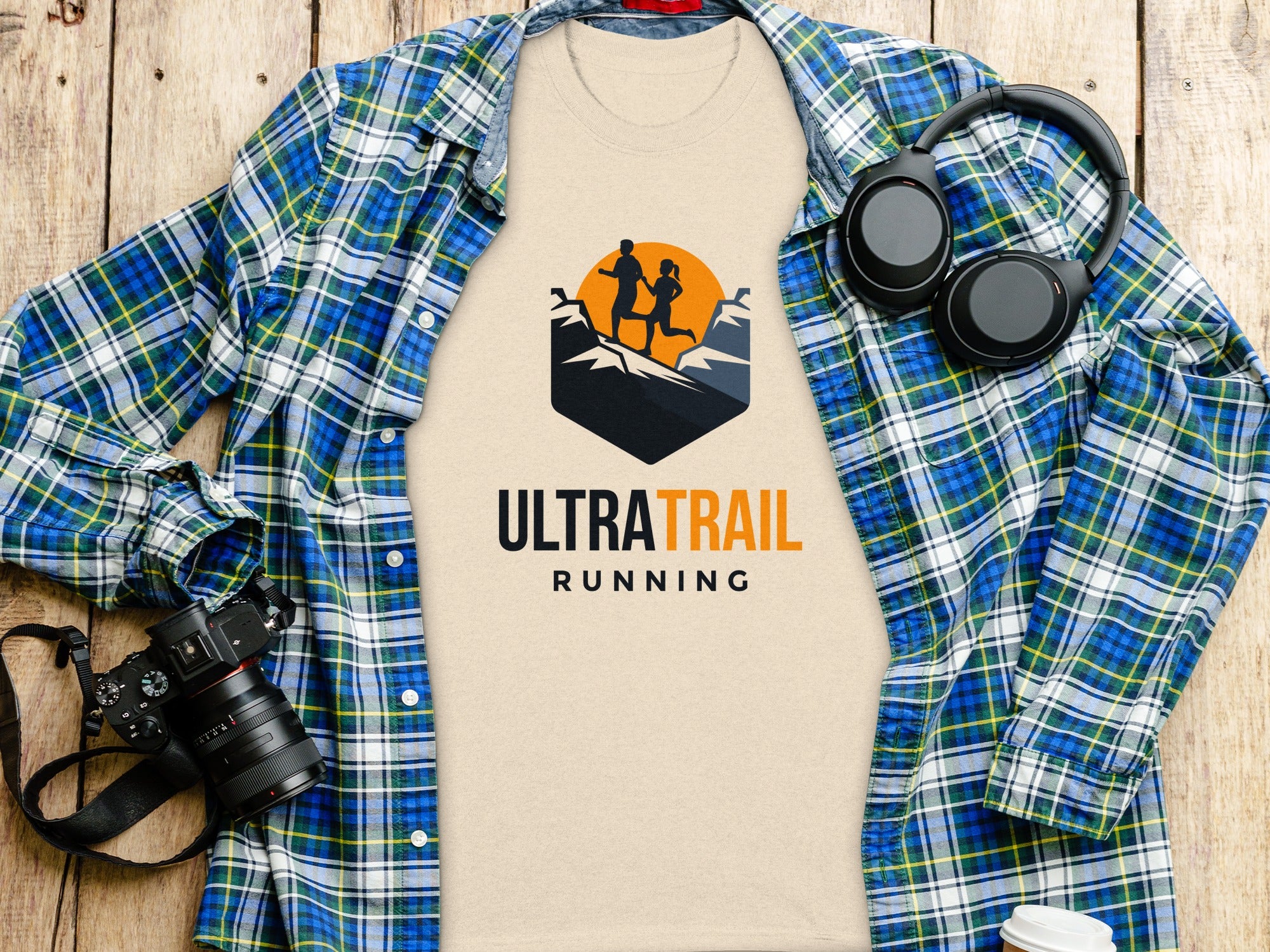 T-shirt with "ULTRA TRAIL RUNNING" text and graphic of runners on mountains.