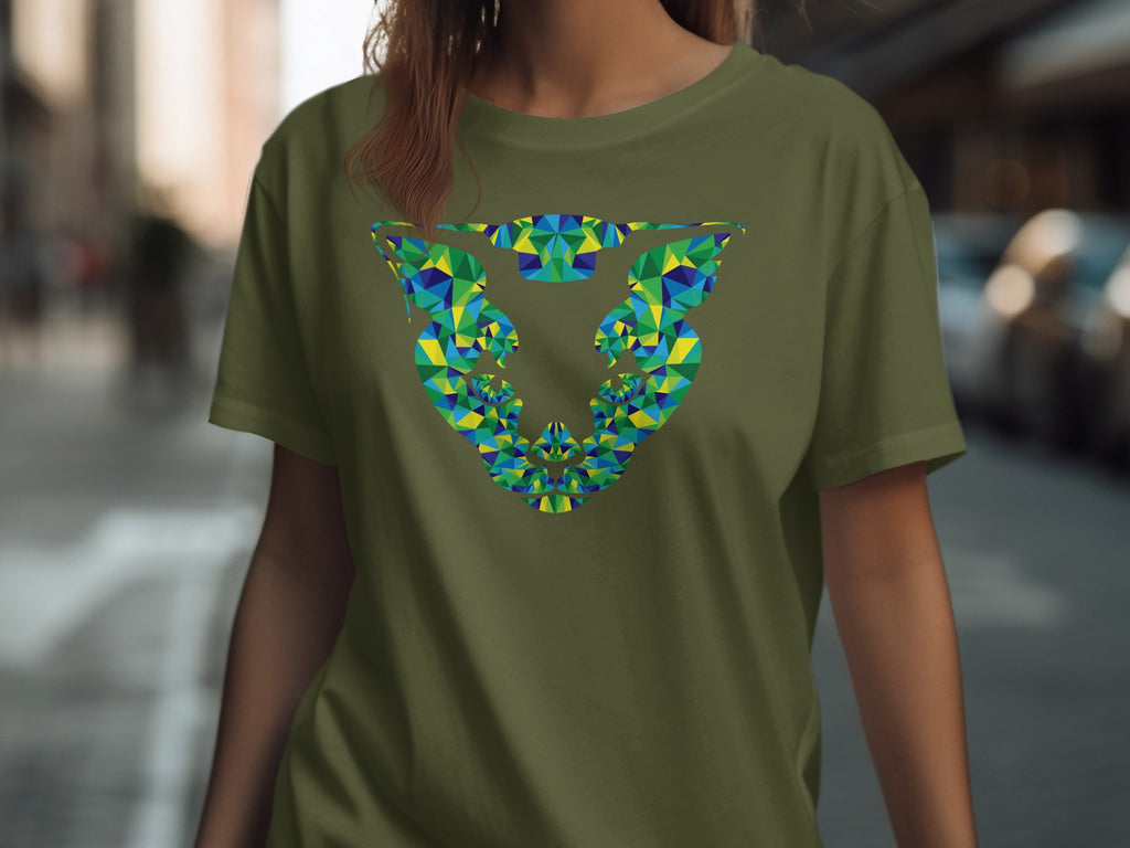 Green t-shirt with colorful geometric abstract design on chest.