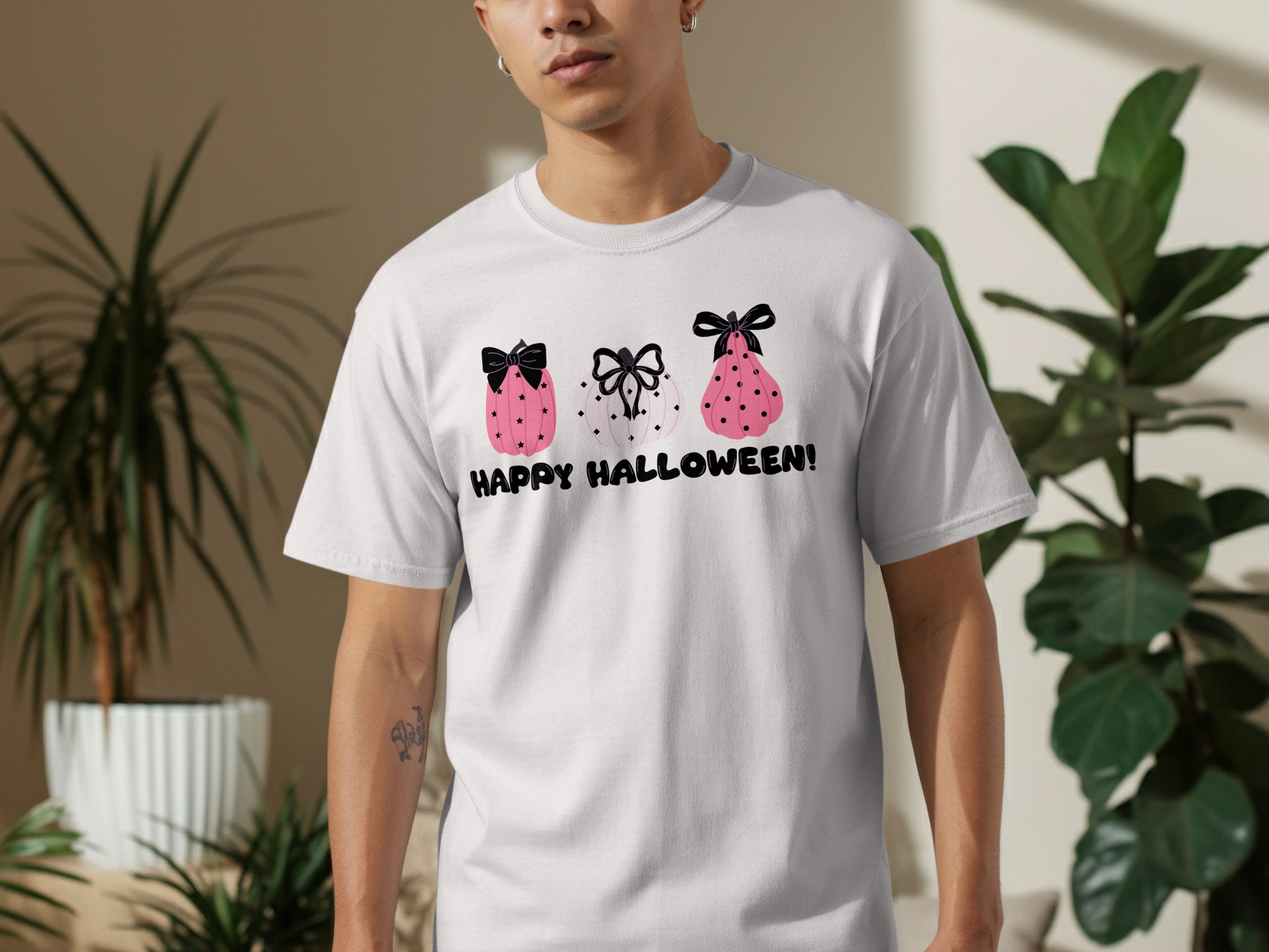 Pink and white pumpkins with black bows and stars, text reads HAPPY HALLOWEEN!